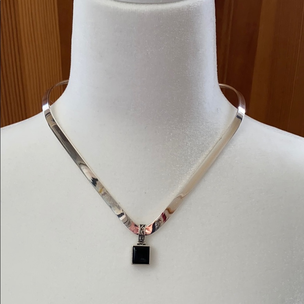 Silver collar necklace with reversible pendant